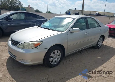 2002 Toyota Camry Le z USA, uszkodzony, nr VIN 4T1BE32K92U029451